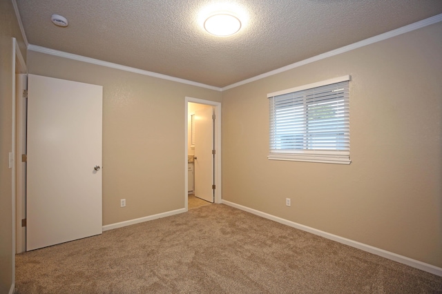 2855 Red Bud Ln, Anderson, CA 96007 - unfurnished bedroom with a textured ceiling, ornamental molding, and carpet floors