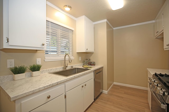 2855 Red Bud Ln, Anderson, CA 96007 - kitchen with appliances with stainless steel finishes, light wood-type flooring, white cabinets, ornamental molding, and a textured ceiling