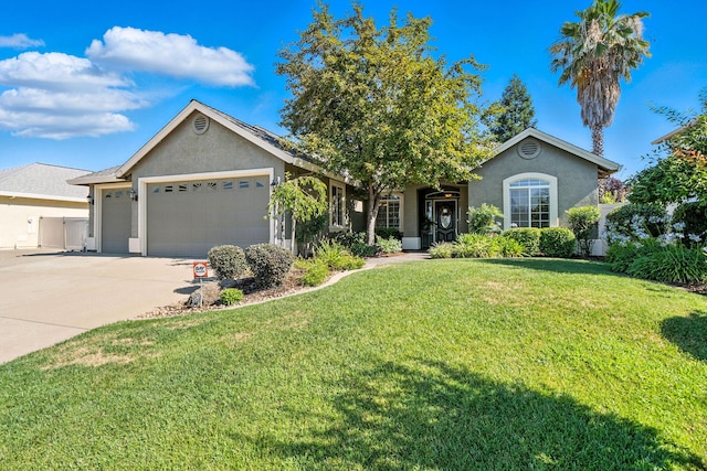 2110 Cilantro Dr, Redding, CA 96003 - ranch-style house featuring stucco siding, an attached garage, and a front yard