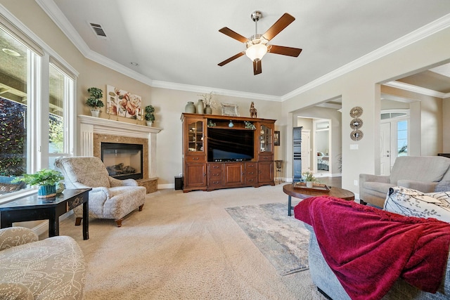 2110 Cilantro Dr, Redding, CA 96003 - living area with light carpet, a ceiling fan, ornamental molding, and a fireplace