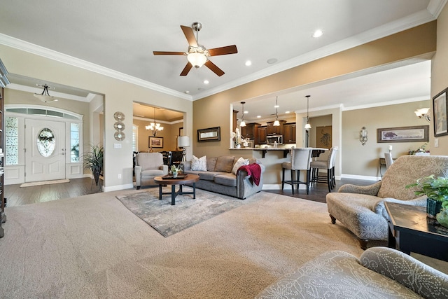 2110 Cilantro Dr, Redding, CA 96003 - living room featuring a ceiling fan, a chandelier, recessed lighting, crown molding, and wood finished floors
