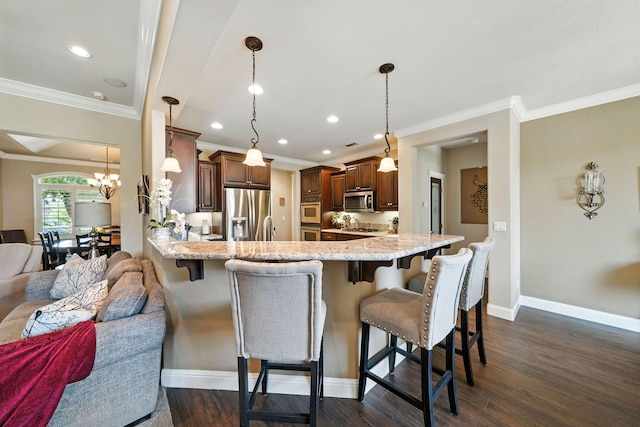 2110 Cilantro Dr, Redding, CA 96003 - kitchen with stainless steel appliances, a peninsula, crown molding, a kitchen breakfast bar, and light stone countertops
