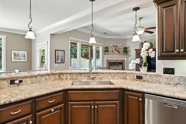 2110 Cilantro Dr, Redding, CA 96003 - kitchen featuring dishwasher, a ceiling fan, a glass covered fireplace, dark brown cabinets, and light stone counters