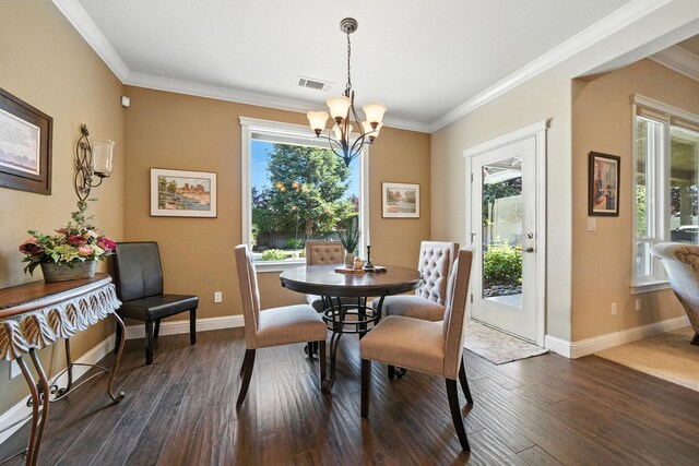 2110 Cilantro Dr, Redding, CA 96003 - dining space with a chandelier, crown molding, and dark wood-style floors