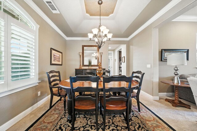 2110 Cilantro Dr, Redding, CA 96003 - dining area featuring a tray ceiling, a chandelier, carpet flooring, and ornamental molding
