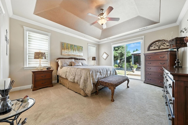 2110 Cilantro Dr, Redding, CA 96003 - bedroom with a tray ceiling, light colored carpet, access to exterior, ornamental molding, and a ceiling fan