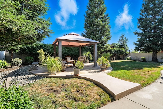 2110 Cilantro Dr, Redding, CA 96003 - fenced backyard featuring a gazebo and a patio area