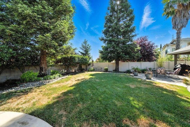 2110 Cilantro Dr, Redding, CA 96003 - fenced backyard featuring a patio area