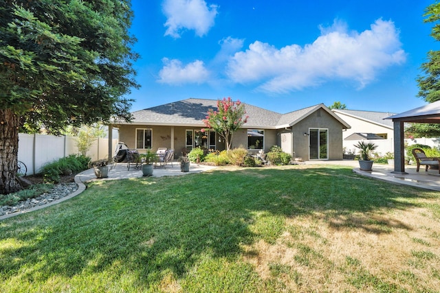2110 Cilantro Dr, Redding, CA 96003 - view of front of home with stucco siding, a patio area, and a gazebo