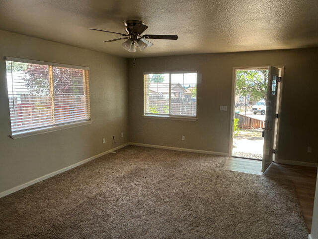 3995 Vassar Way, Shasta Lake, CA 96019 - carpeted spare room with a ceiling fan and a textured ceiling