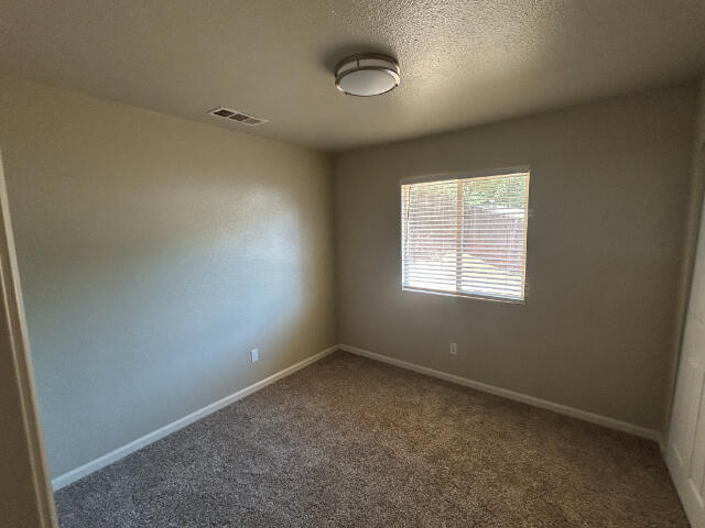 3995 Vassar Way, Shasta Lake, CA 96019 - carpeted empty room featuring baseboards