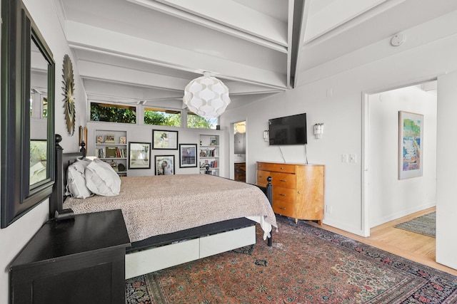 3540 Scenic Dr, Redding, CA 96001 - bedroom featuring beamed ceiling, wood finished floors, and a chandelier