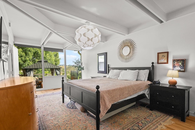 3540 Scenic Dr, Redding, CA 96001 - bedroom with light wood-style floors and beamed ceiling