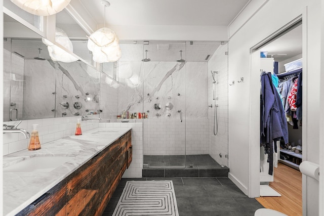 3540 Scenic Dr, Redding, CA 96001 - full bathroom with a stall shower, double vanity, a spacious closet, tasteful backsplash, and tile patterned flooring