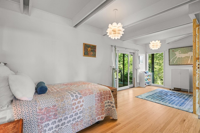 3540 Scenic Dr, Redding, CA 96001 - bedroom with wood finished floors, access to exterior, and beam ceiling
