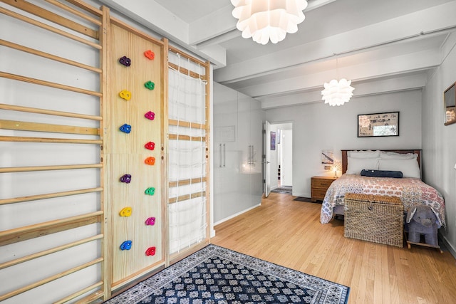 3540 Scenic Dr, Redding, CA 96001 - bedroom with a chandelier, beam ceiling, and wood finished floors