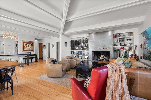 3540 Scenic Dr, Redding, CA 96001 - living room featuring wood finished floors, a fireplace, and built in features