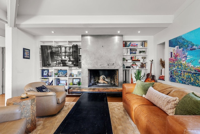 3540 Scenic Dr, Redding, CA 96001 - living area featuring built in shelves, a high end fireplace, and wood finished floors