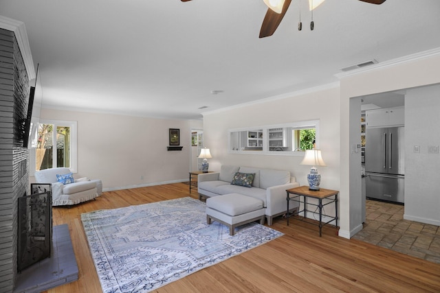 2920 Pioneer Dr, Redding, CA 96001 - living area with ceiling fan, a fireplace, plenty of natural light, and ornamental molding