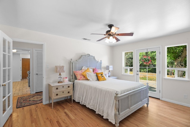 2920 Pioneer Dr, Redding, CA 96001 - bedroom featuring access to exterior, light wood-style floors, french doors, and ceiling fan