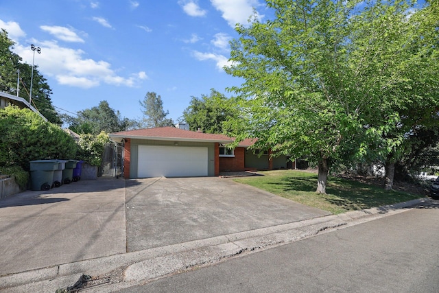 2920 Pioneer Dr, Redding, CA 96001 - view of front of home featuring brick siding, driveway, an attached garage, and a front yard
