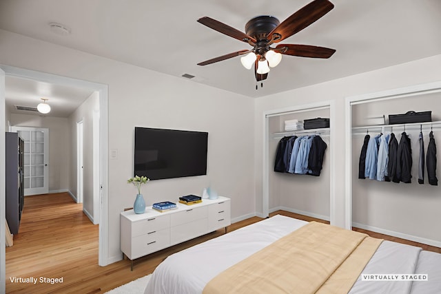 2920 Pioneer Dr, Redding, CA 96001 - bedroom with multiple closets, light wood finished floors, and ceiling fan