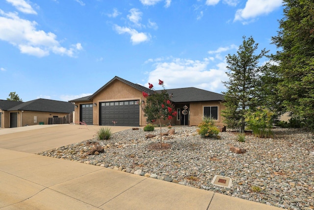 4075 Pembroke Ln, Shasta Lake, CA 96019 - ranch-style home with a garage, concrete driveway, and stucco siding