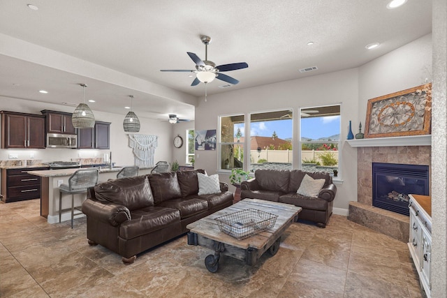 4075 Pembroke Ln, Shasta Lake, CA 96019 - living area featuring a ceiling fan, recessed lighting, and a tile fireplace