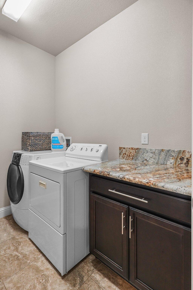 4075 Pembroke Ln, Shasta Lake, CA 96019 - laundry area with washing machine and clothes dryer, cabinet space, and a textured ceiling