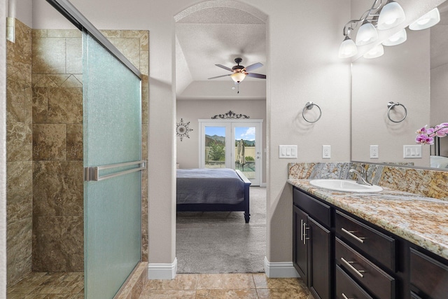 4075 Pembroke Ln, Shasta Lake, CA 96019 - full bath with ceiling fan, connected bathroom, a stall shower, vanity, and lofted ceiling
