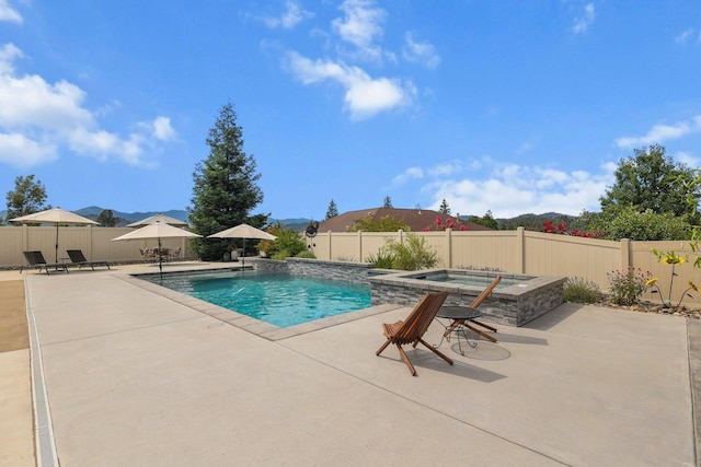 4075 Pembroke Ln, Shasta Lake, CA 96019 - view of pool with an in-ground hot tub, a patio area, and a fenced backyard