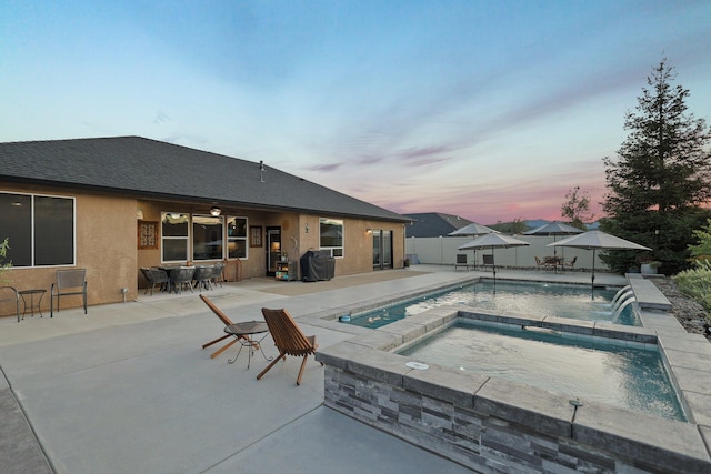 4075 Pembroke Ln, Shasta Lake, CA 96019 - view of pool featuring a patio area, an in-ground hot tub, a fenced backyard, and outdoor dining area