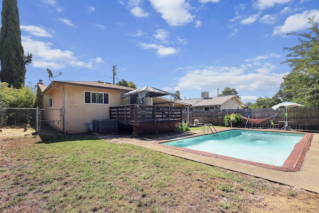 2196 Victor Ave, Redding, CA 96002 - view of swimming pool with a wooden deck and a fenced backyard