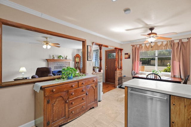 2196 Victor Ave, Redding, CA 96002 - kitchen featuring dishwasher, ceiling fan, light countertops, a brick fireplace, and crown molding