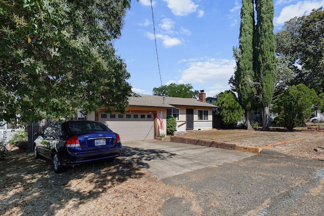 2196 Victor Ave, Redding, CA 96002 - view of front facade with an attached garage, driveway, and a chimney