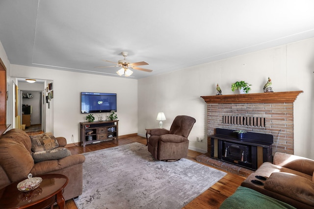 2196 Victor Ave, Redding, CA 96002 - living room with wood finished floors, a ceiling fan, and a fireplace