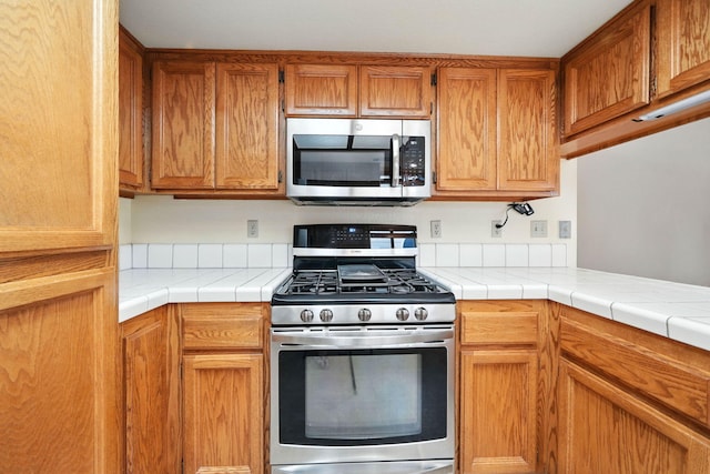 2585 Meadowview Dr, Red Bluff, CA 96080 - kitchen with stainless steel appliances and brown cabinets