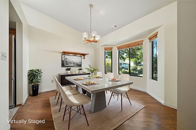 2585 Meadowview Dr, Red Bluff, CA 96080 - dining room with hardwood / wood-style flooring, a chandelier, and vaulted ceiling