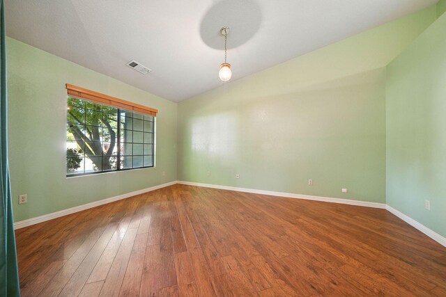 2585 Meadowview Dr, Red Bluff, CA 96080 - unfurnished room featuring wood finished floors and lofted ceiling
