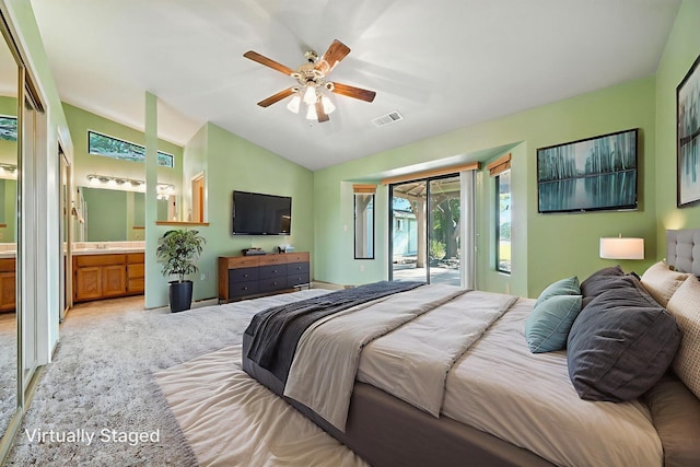 2585 Meadowview Dr, Red Bluff, CA 96080 - bedroom featuring access to exterior, lofted ceiling, ensuite bathroom, a ceiling fan, and light colored carpet