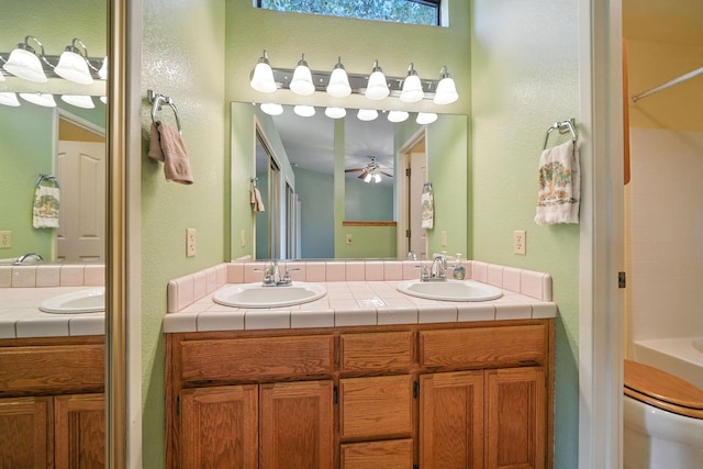 2585 Meadowview Dr, Red Bluff, CA 96080 - full bath with double vanity, a ceiling fan, tub / shower combination, and a textured wall