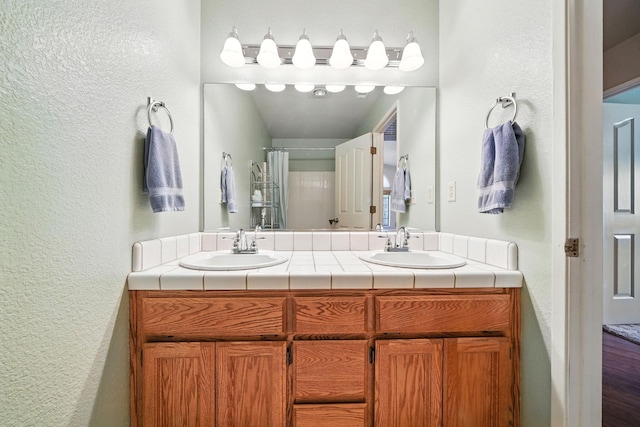 2585 Meadowview Dr, Red Bluff, CA 96080 - full bath featuring a textured wall and double vanity
