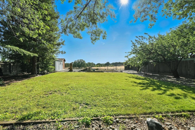 2585 Meadowview Dr, Red Bluff, CA 96080 - fenced backyard featuring a storage unit