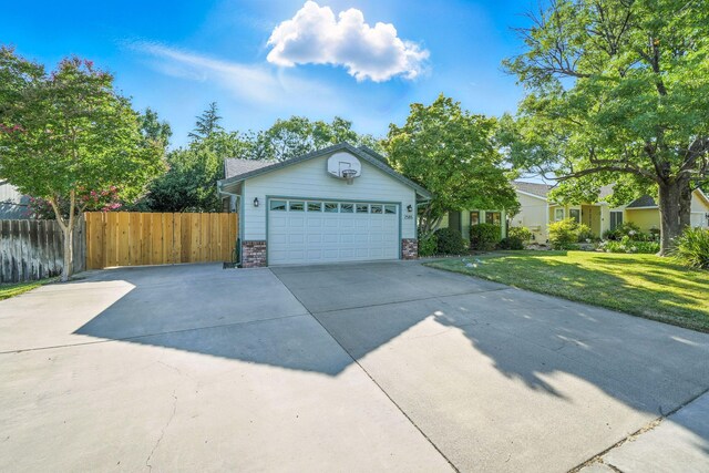 2585 Meadowview Dr, Red Bluff, CA 96080 - ranch-style house with concrete driveway and an attached garage