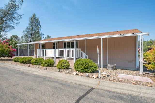 3304 Shasta Dam Blvd Unit 173, Shasta Lake, CA 96019 - view of front facade with covered porch and a carport
