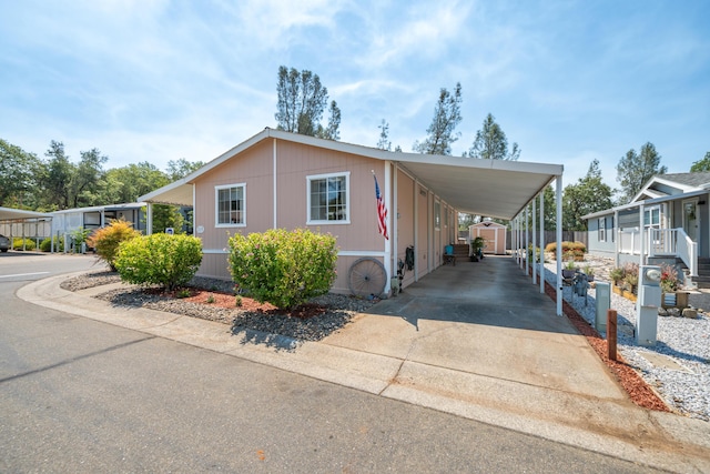 3304 Shasta Dam Blvd Unit 173, Shasta Lake, CA 96019 - manufactured / mobile home with an attached carport and concrete driveway