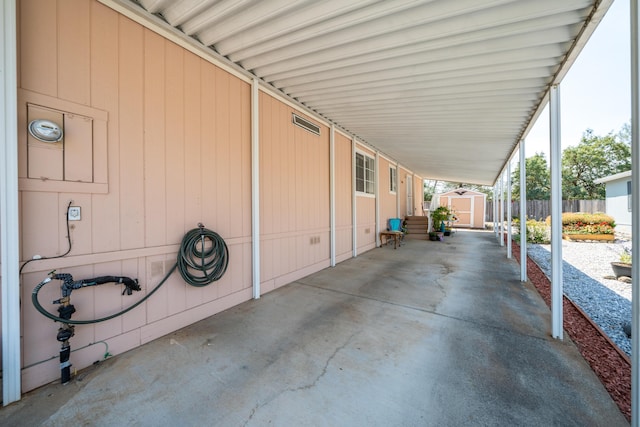 3304 Shasta Dam Blvd Unit 173, Shasta Lake, CA 96019 - view of patio / terrace featuring a storage unit and a carport