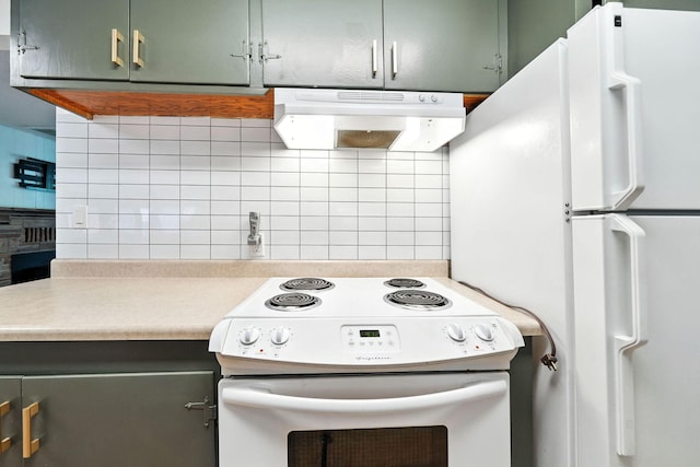 1520 Minor St, Redding, CA 96002 - kitchen with white appliances, ventilation hood, backsplash, light countertops, and green cabinets