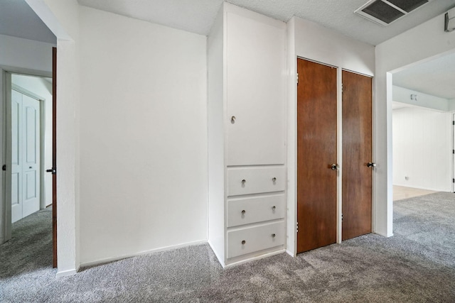 1520 Minor St, Redding, CA 96002 - unfurnished bedroom featuring carpet flooring and two closets