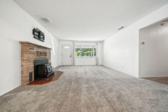 1520 Minor St, Redding, CA 96002 - unfurnished living room with a wood stove and carpet